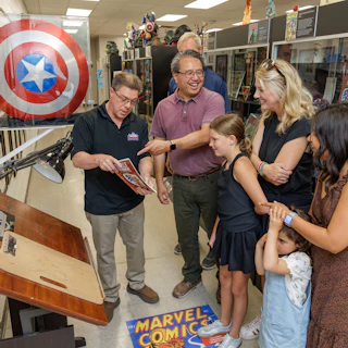 Five people enjoying a tour at Hall of Heroes for their signature experience.