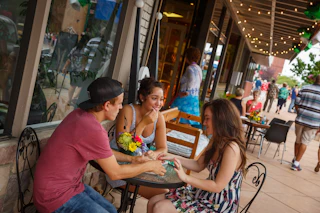 People dining outdoors in downtown Elkhart, Indiana